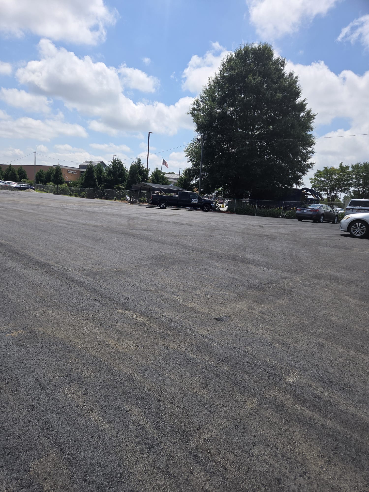 Finished asphalt parking lot serving a commercial property